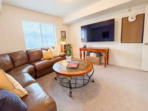 Living room with baseboards and carpet flooring