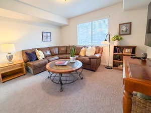 Living room with carpet floors and baseboards