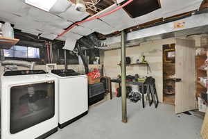 Below grade area with washer and clothes dryer