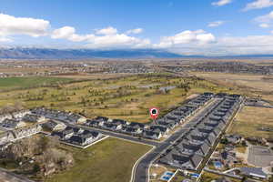 Aerial perspective of suburban area featuring a mountainous background
