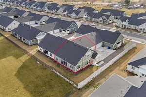 Aerial view of residential area featuring property boundaries highlighted