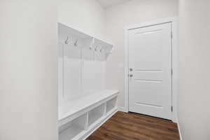Mudroom with dark wood-style floors