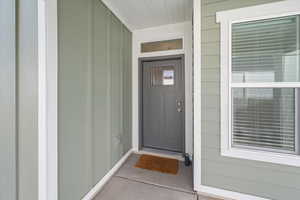 Entrance to property with board and batten siding