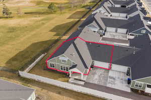 Aerial view of property and surrounding area with property parcel outlined