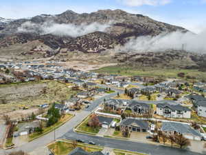 Aerial perspective of suburban area featuring a mountainous background
