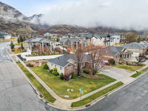 Aerial perspective of suburban area with a mountain backdrop