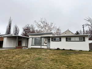 View of front of home with a carport