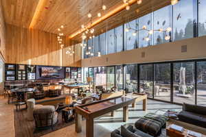 Lobby featuring a high wooden ceiling and wood walls