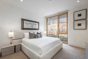 Bedroom featuring recessed lighting and light colored carpet