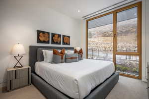 Bedroom featuring light colored carpet and recessed lighting