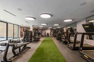 Exercise room featuring floor to ceiling windows