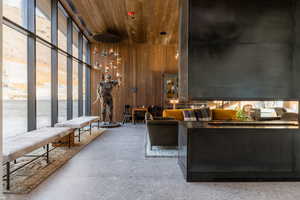 Building lobby featuring wood walls and a high wooden ceiling