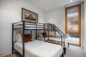 Bedroom featuring light colored carpet and recessed lighting