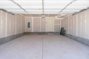 Garage featuring electric panel
