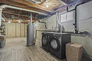 Below grade area featuring washing machine and dryer and gas water heater