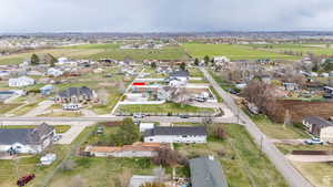 Aerial overview of property's location featuring nearby suburban area