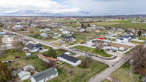 Aerial view of property's location with nearby suburban area