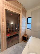Relaxing sauna / steam room featuring wood walls