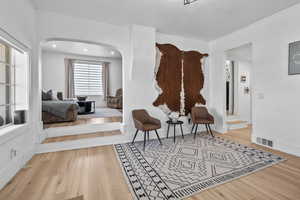 Sitting room featuring light wood finished floors and baseboards