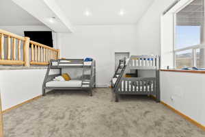 Carpeted bedroom featuring baseboards and recessed lighting