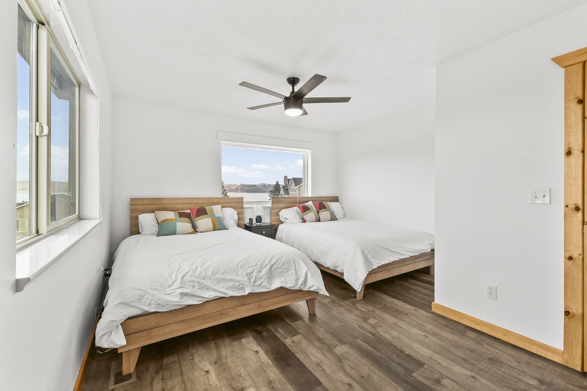 Bedroom with wood finished floors and a ceiling fan
