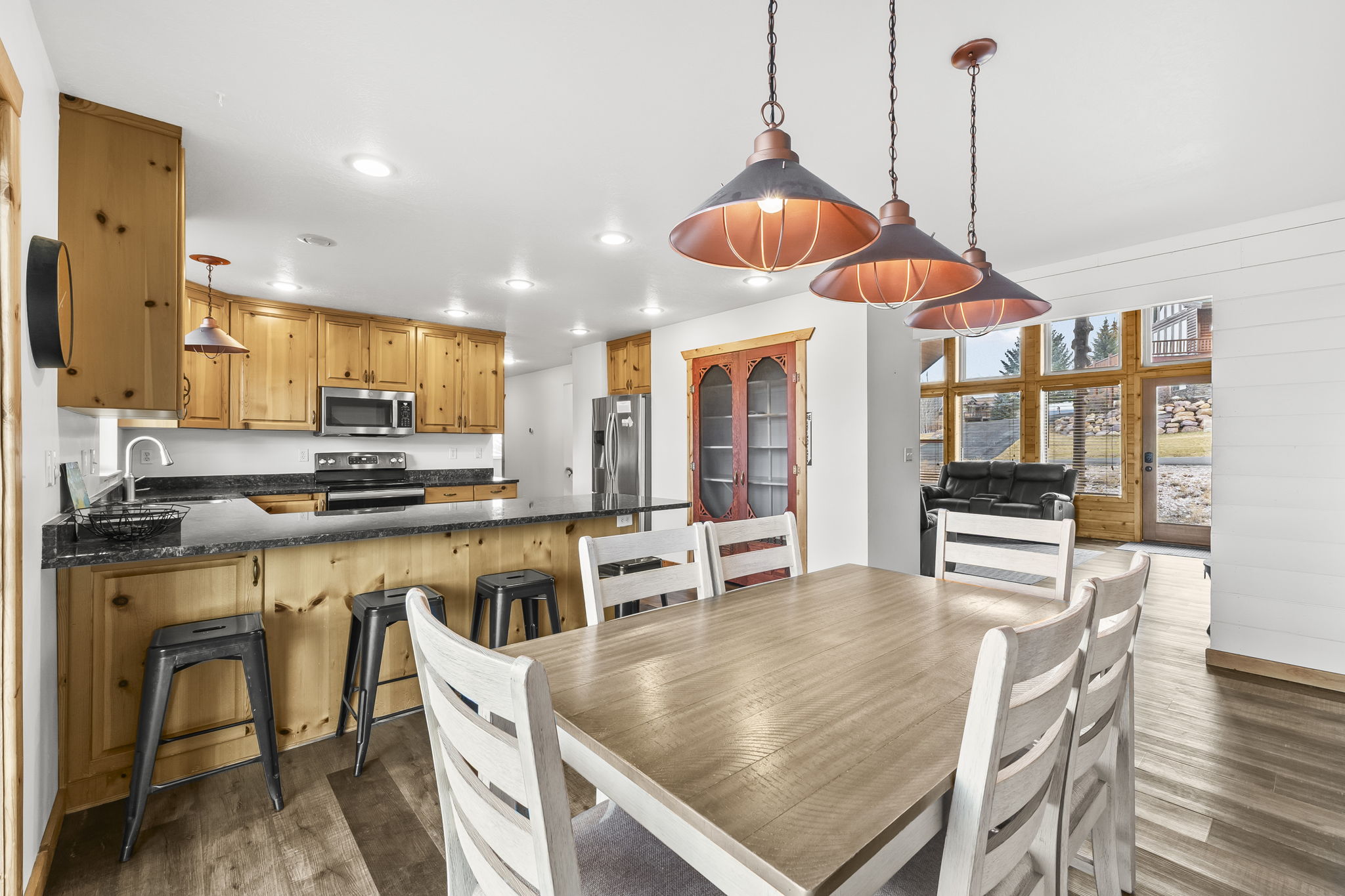 Dining room featuring light wood-type flooring, recessed lighting, and french doors