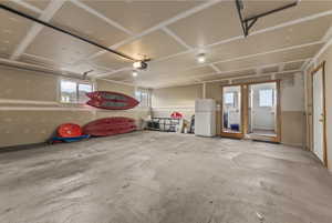 Garage with freestanding refrigerator