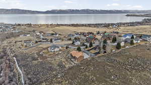 Aerial perspective of suburban area with a water and mountain view