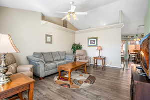 Updated Living area with vaulted ceiling, LVP floors, ceiling fan, and recessed lighting