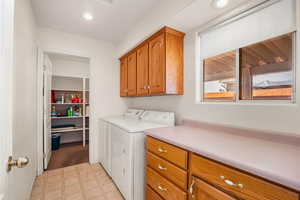 Laundry area with separate large storage area. Washer and dryer included
