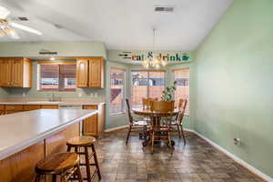 Large Dining area with large bay windows.