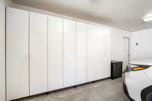 2 car garage has built in cabinets for storage
