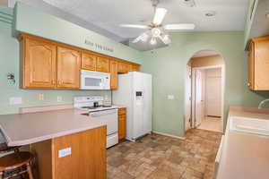 Refrigerator, range, microwave  and dishwasher included.