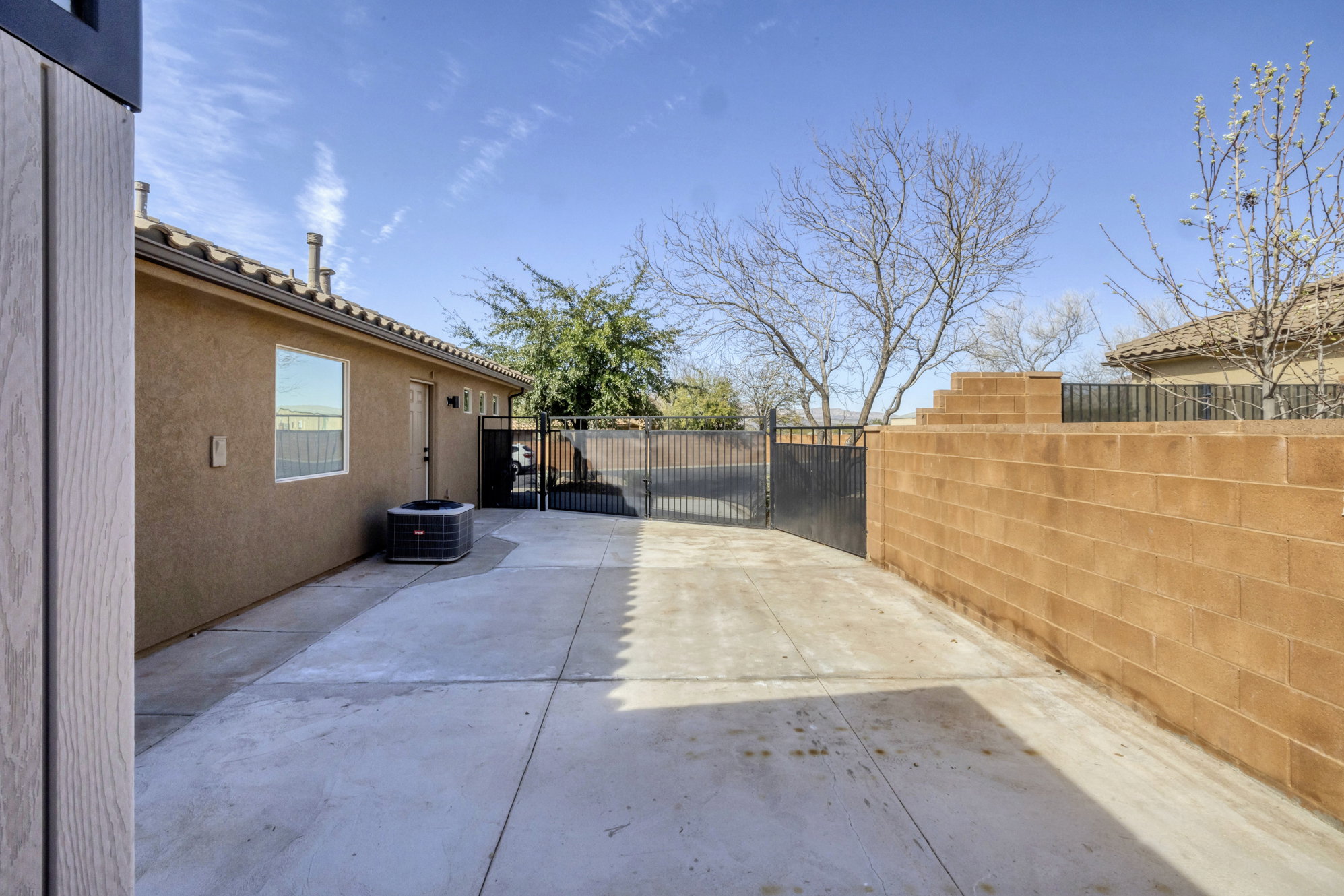 View of patio featuring a gate