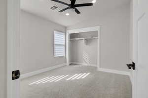 Unfurnished bedroom featuring vaulted ceiling, light colored carpet, a ceiling fan, a closet, and recessed lighting