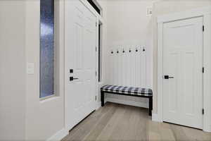 Mudroom with light wood-type flooring