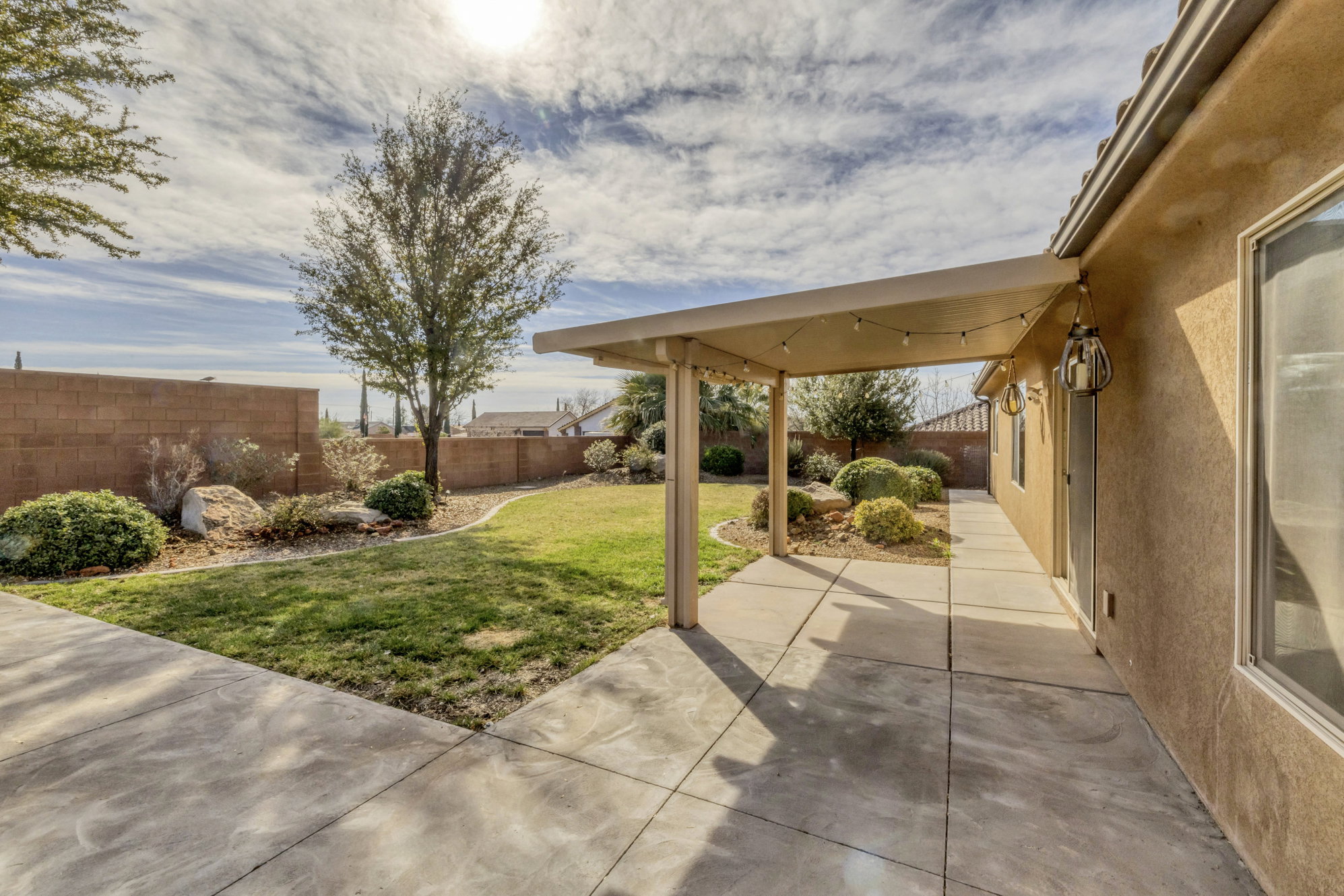 Fenced backyard featuring a patio