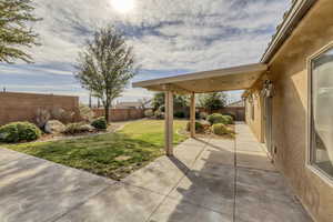 Fenced backyard featuring a patio