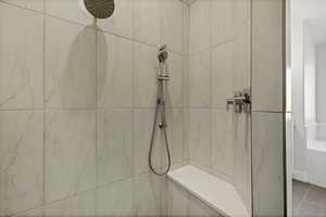 Bathroom with a marble finish shower