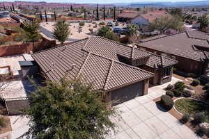 Aerial perspective of suburban area with a mountainous background