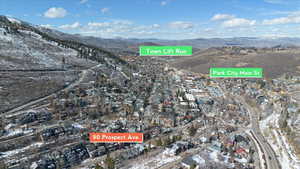 View of property location with mountains and nearby suburban area