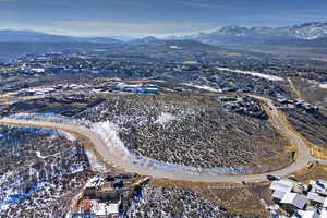 Snowy aerial view with a mountain view