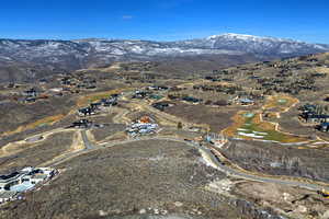 View of property location with mountains and nearby suburban area