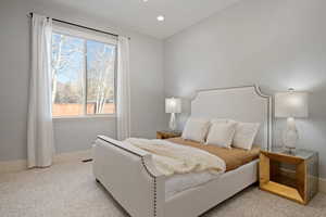 Bedroom featuring light carpet and recessed lighting