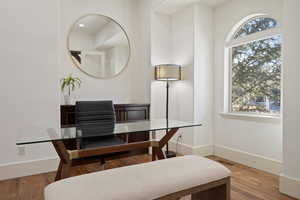 Office area featuring wood finished floors and baseboards