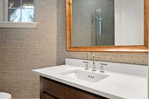 Bathroom with vanity and an enclosed shower