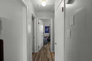 Hallway with light wood-type flooring