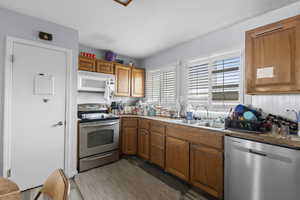 Kitchen with stainless steel appliances and wood finish cabinets