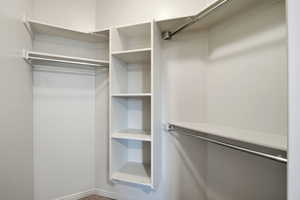 Walk in closet with carpet flooring