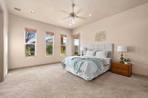 Bedroom featuring a ceiling fan, light carpet, and recessed lighting